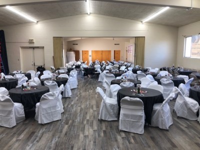 rev dr sharon stanley-rea room set up for a wedding with tables and chairs